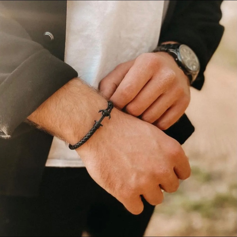 Black recycled leather fiber bracelet with black stainless steel clasp.